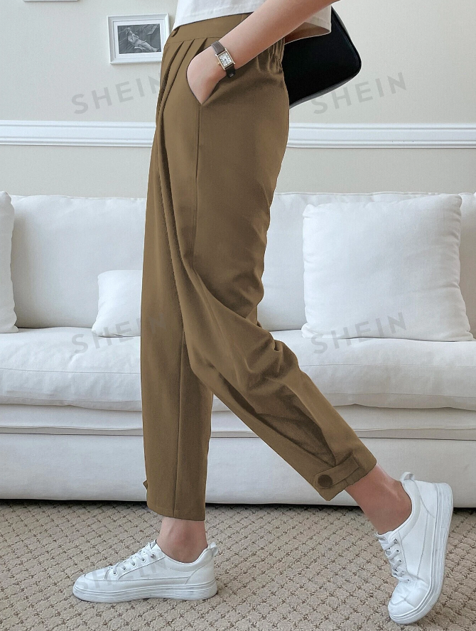 Brown plicated slant pocket pants